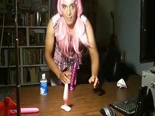 Crossdresser in Pink Plays with New Fuck Toy